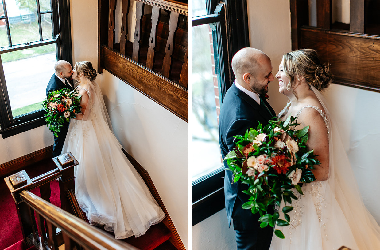 Bride and groom kiss on the stairway at The Historic German House in Rochester NY