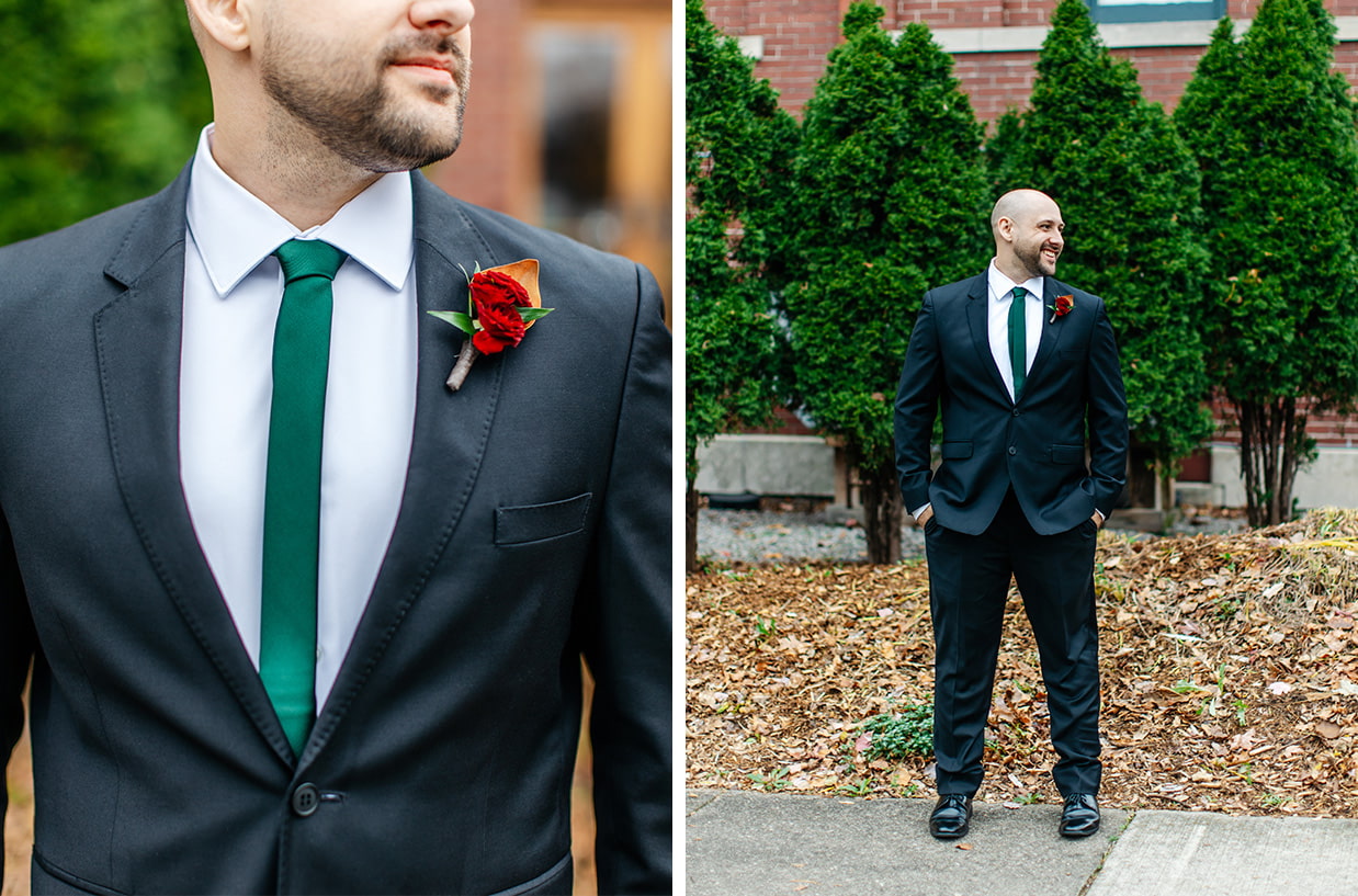 Groom smiles in front of plants and a brick wall at The Historic German House in Rochester NY