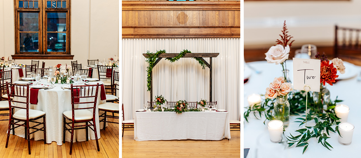 The wedding reception space at The Historic German House in Rochester NY decorated with red and pink flowers, greenery, and candles
