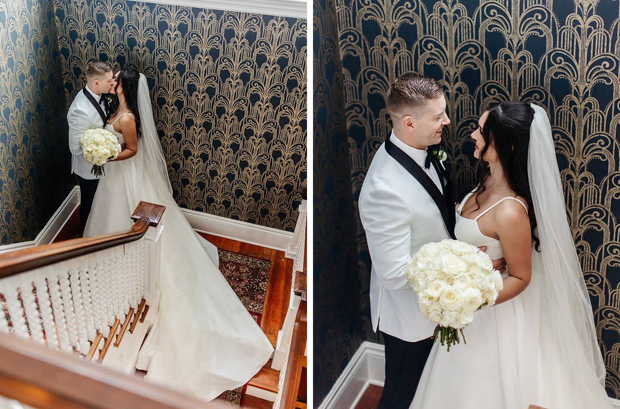Bride and Groom kiss on a stairway landing decked out in Art Deco wallpaper
